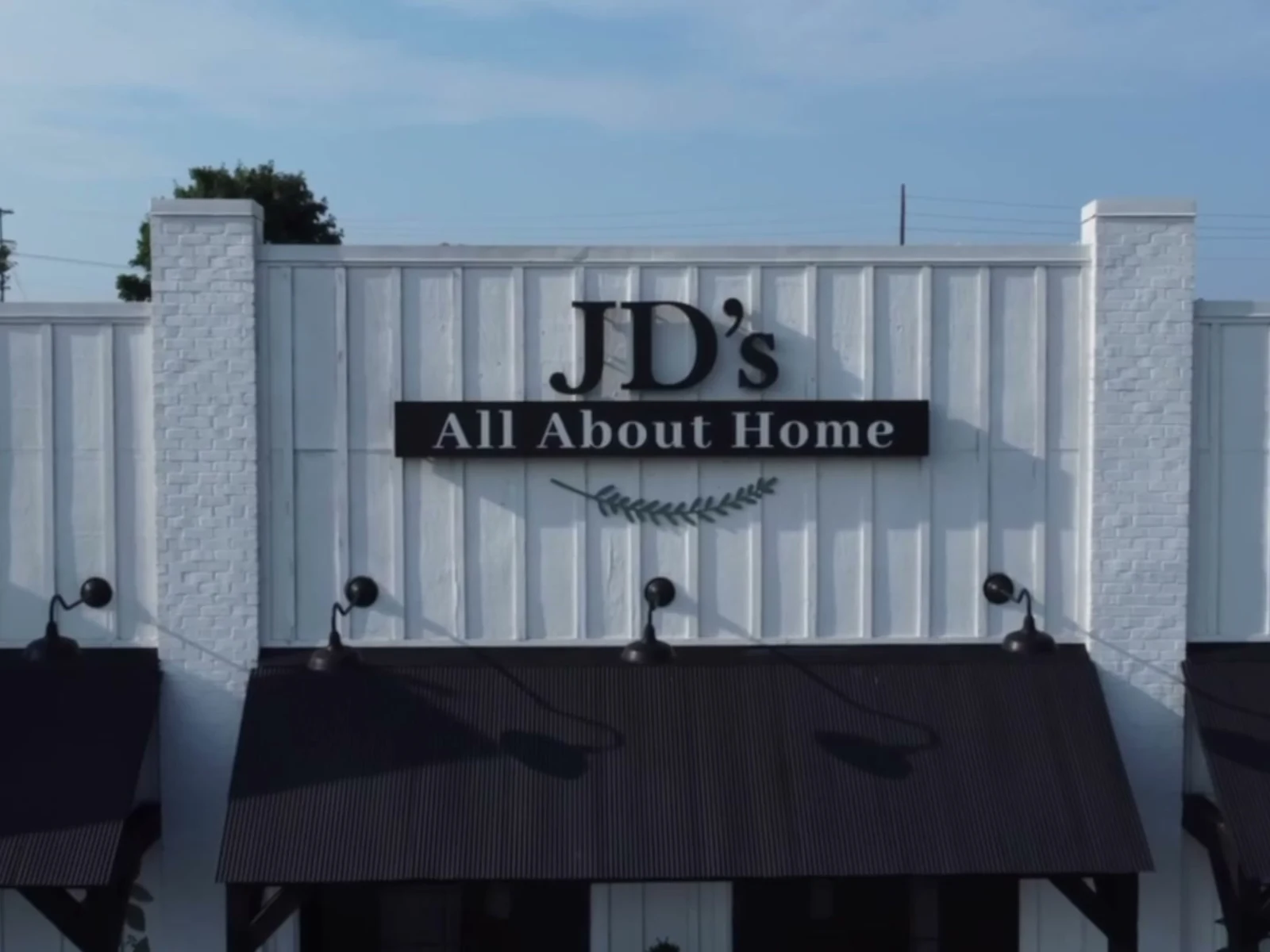 Exterior sign at the JD's All About Home showroom on Old Fort Parkway