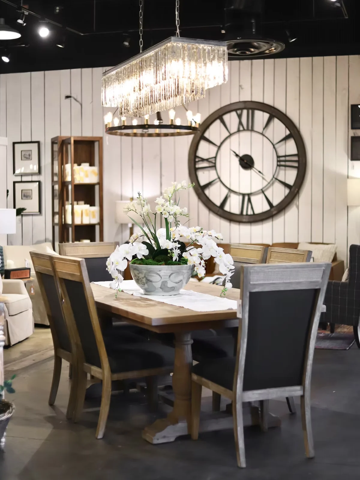 Dining furniture and statement lighting displayed in the JD's showroom
