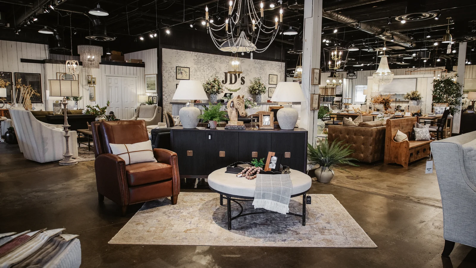 Wide view of furniture, lighting, and decor inside the JD's showroom