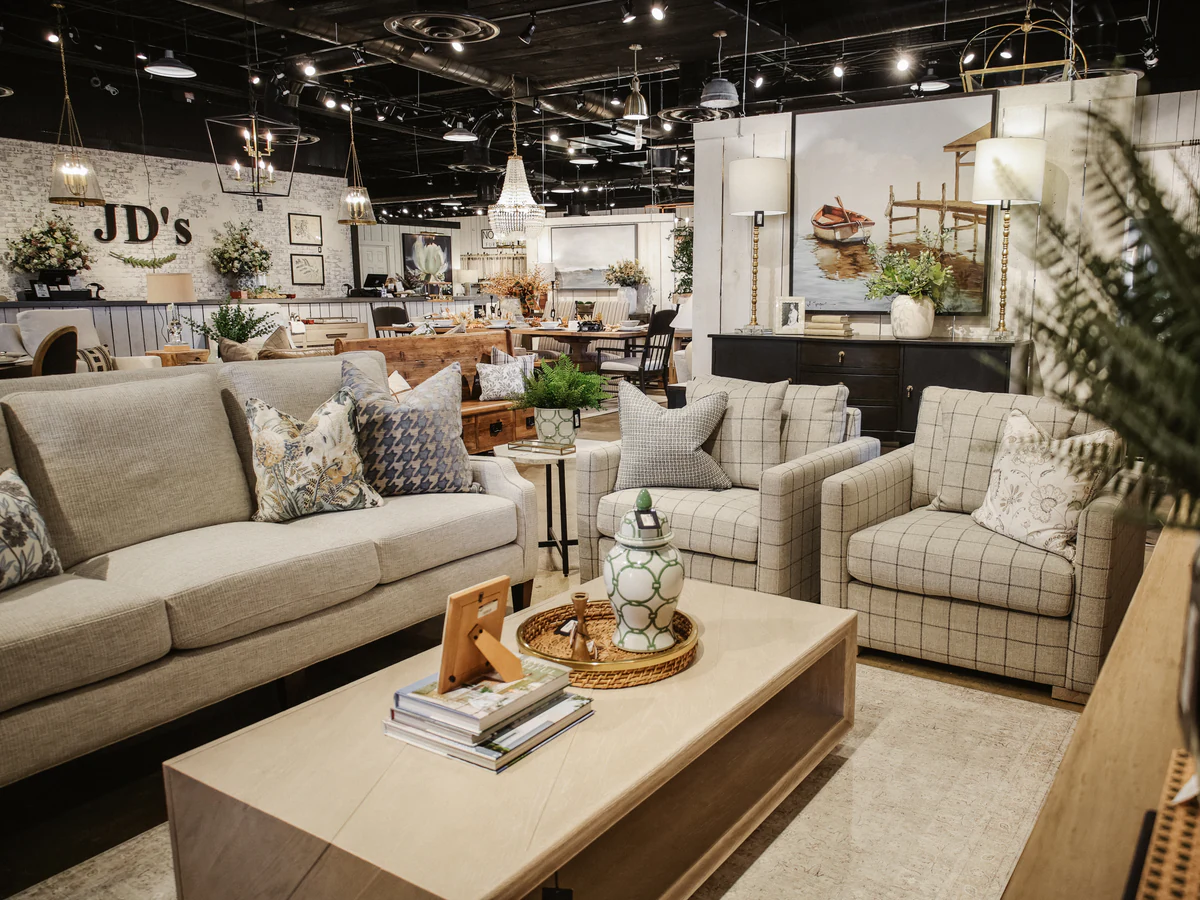 Layered living-room grouping inside the JD's showroom
