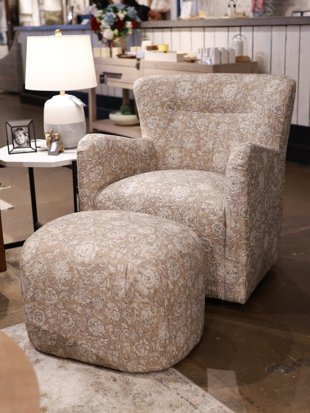 Patterned upholstered chair with a matching round ottoman